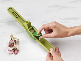 Joseph Joseph CleanForce garlic press bristle cleaning tool removes garlic residue from holes