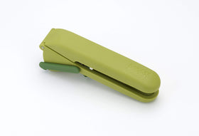 Joseph Joseph CleanForce garlic press showing cleaning tool stored inside the handle