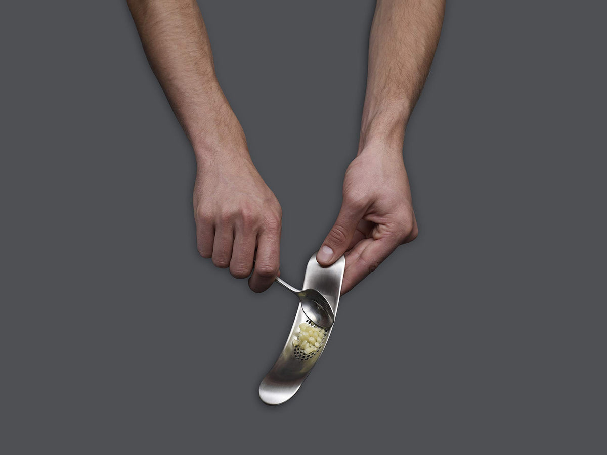 Joseph Joseph crushed garlic scoop ready to transfer to pan.
