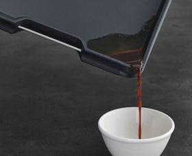 Joseph Joseph Cut&Carve Plus angled base guides drips away from counter