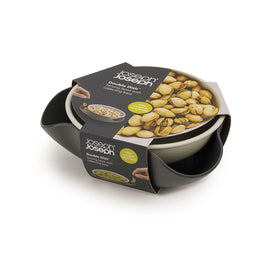 Joseph Joseph Double Dish showing olives and built-in waste disposal to reduce extra bowls.