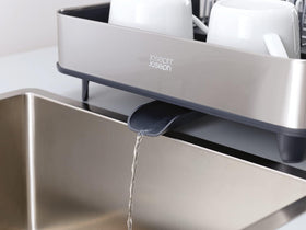 Joseph Joseph drainage spout directs water into sink for a dry countertop.