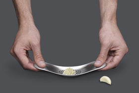 Joseph Joseph garlic mincer in use for even texture.