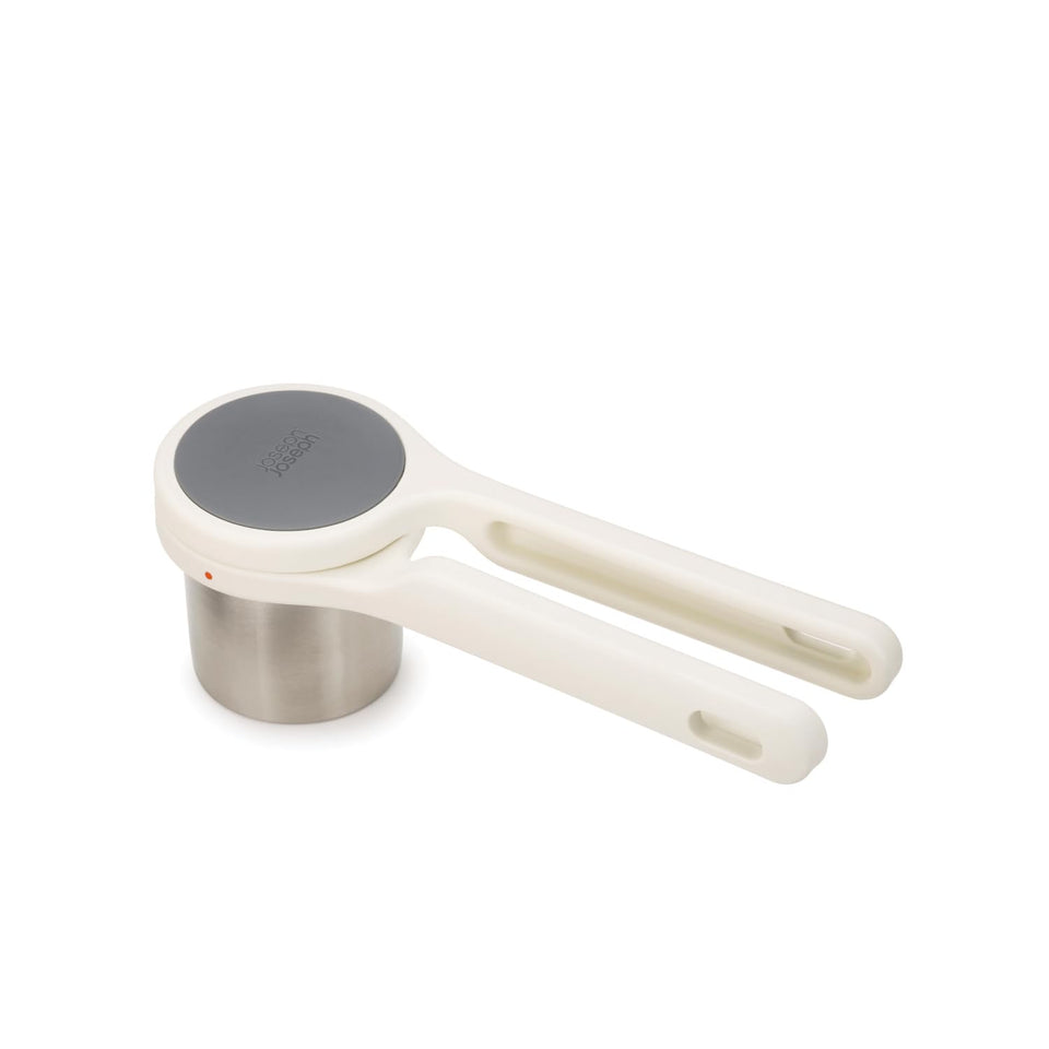 Joseph Joseph Helix potato ricer twist-action in use for smooth mashed potatoes