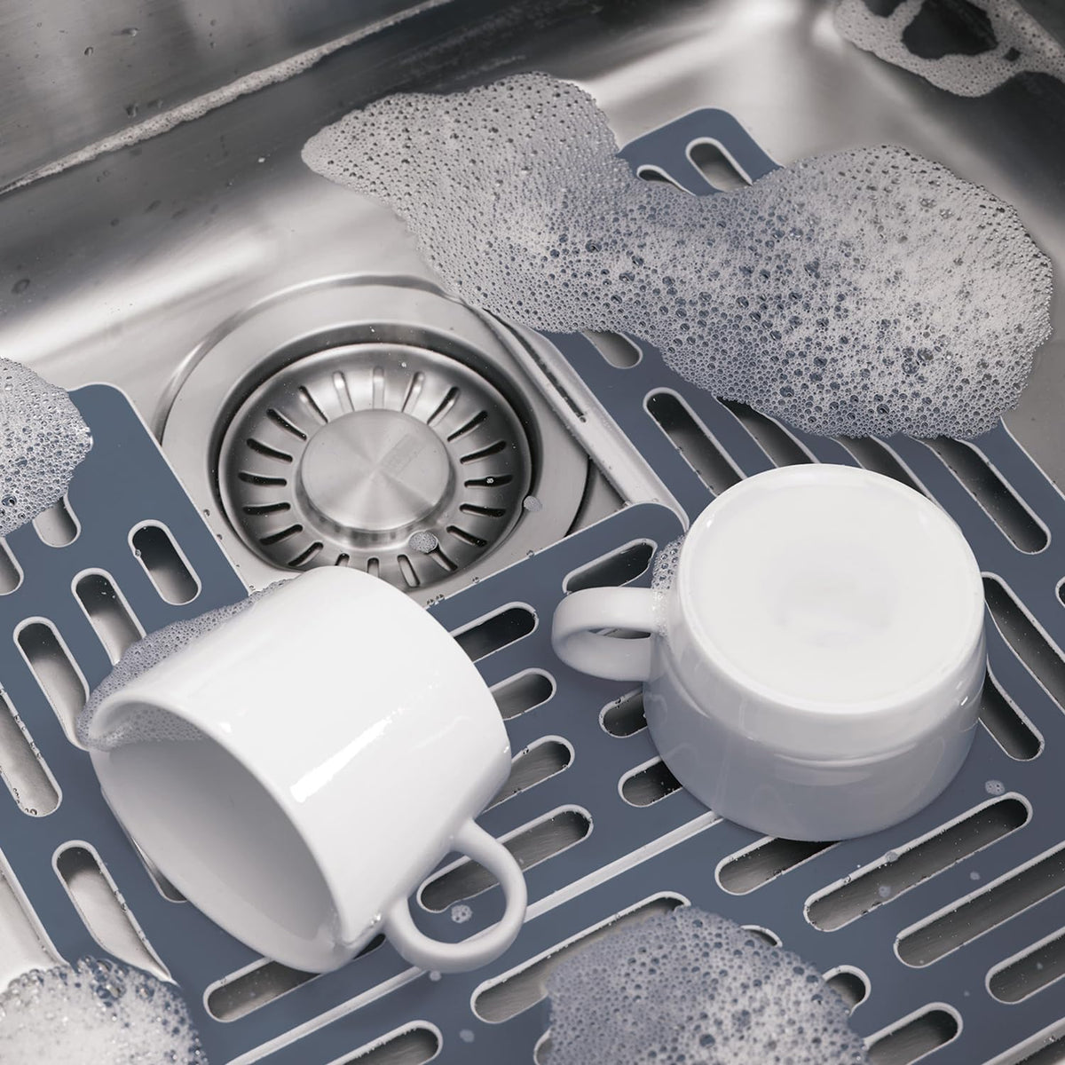 Joseph Joseph Sinksaver gray small piece supports small items in sink.