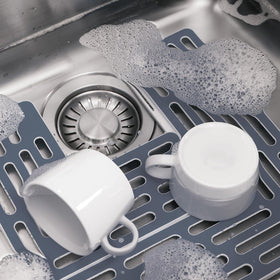 Joseph Joseph Sinksaver gray small piece supports small items in sink.