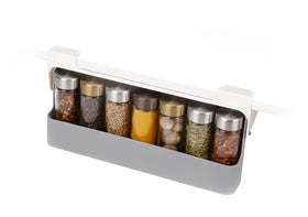 Joseph Joseph spice rack under-shelf organizer shown during installation, increases cabinet storage.