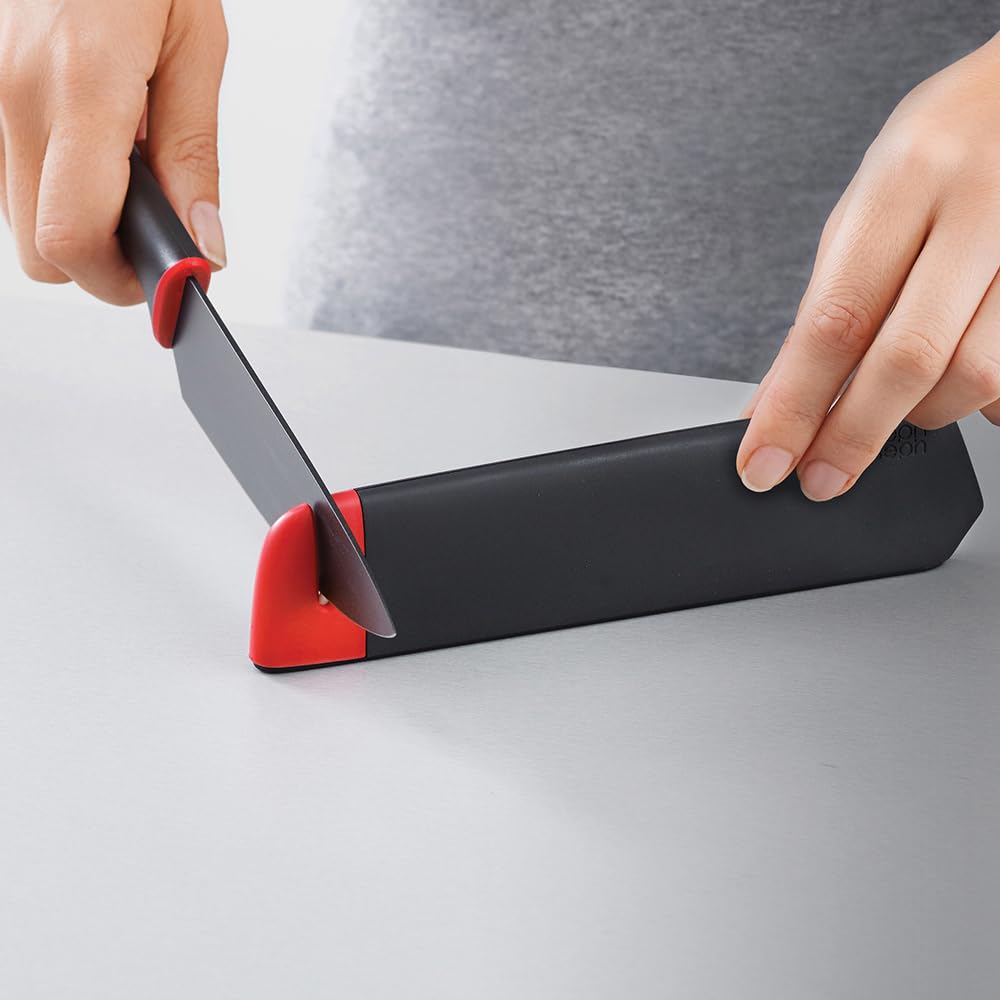 Joseph Joseph stainless steel blades coated with non-stick finish for smooth slicing.