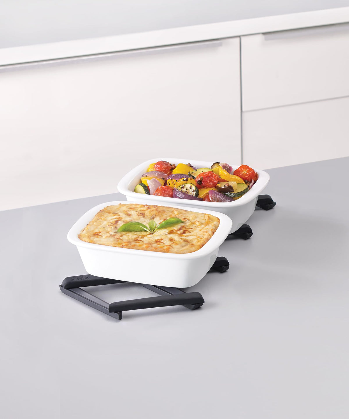 Joseph Joseph Stretch trivet on kitchen counter showing heat resistance and grip