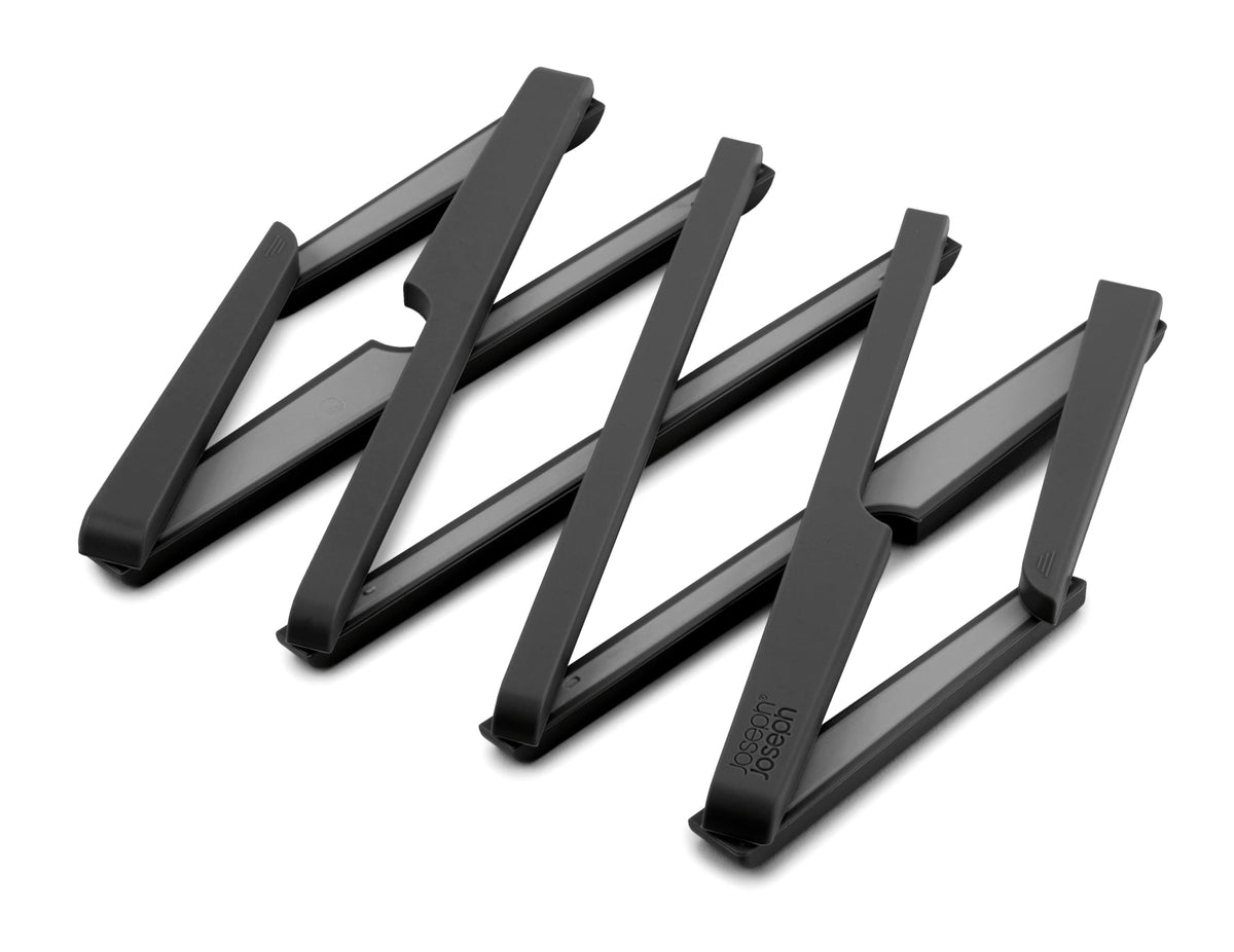 Joseph Joseph Stretch trivet extended supports multiple pans on counter