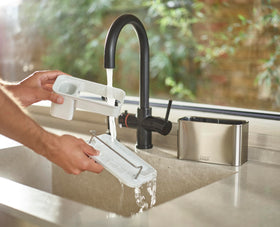 Joseph Joseph Surface sponge rail holds wet sponges in place for quick drainage.