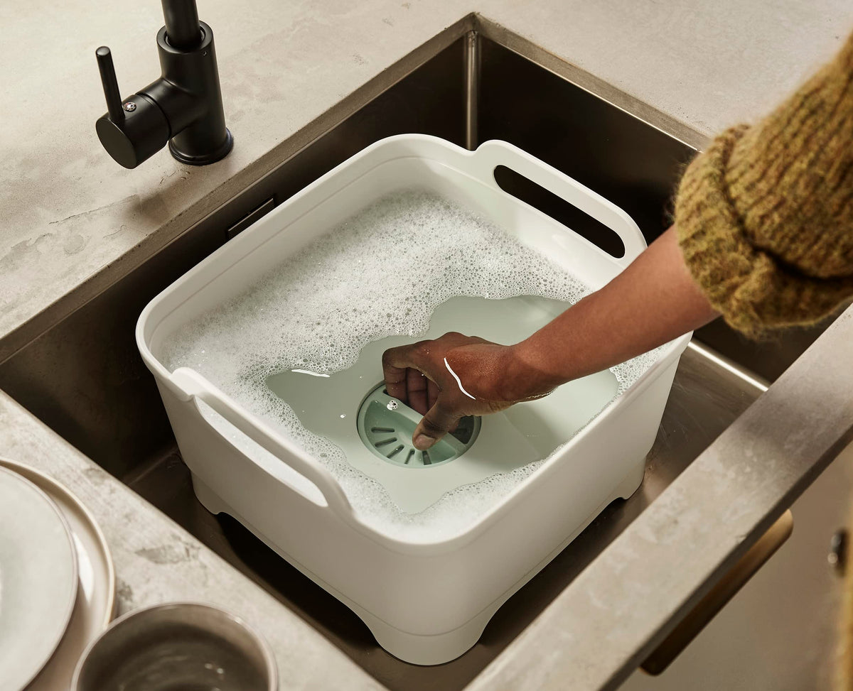 Joseph Joseph Wash and Drain bowl in sink showing contained water