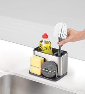Sloped base drains water out of sight for a tidy sink area.