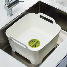 Joseph Joseph Wash & Drain basin with sturdy carry handles for easy transport.