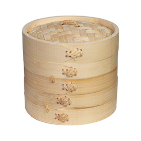 Joyce Chen 2-Tier Bamboo Steamer baskets cooking dumplings evenly at home.