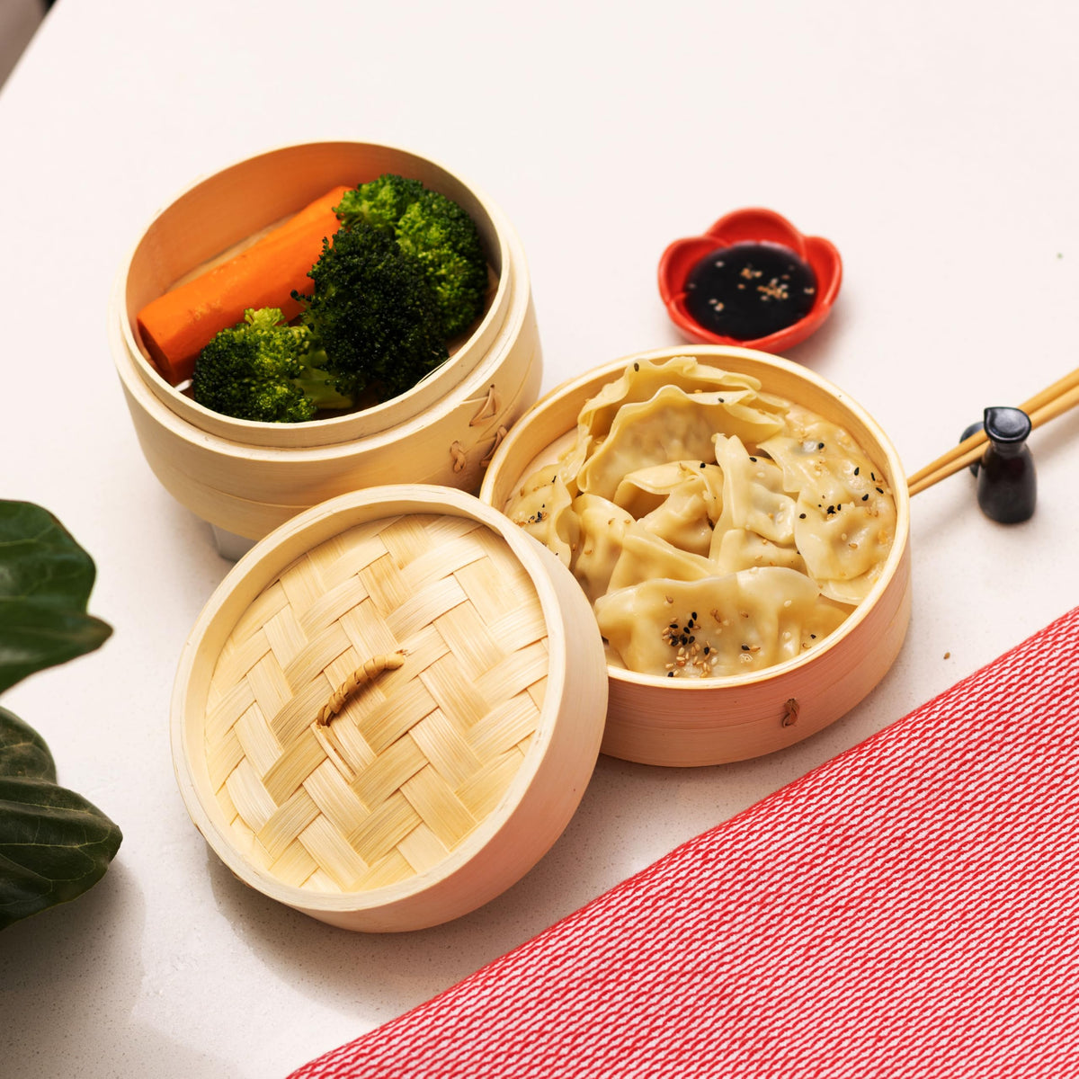 Joyce Chen bamboo steamer over a wok for steaming fish and delicate proteins.