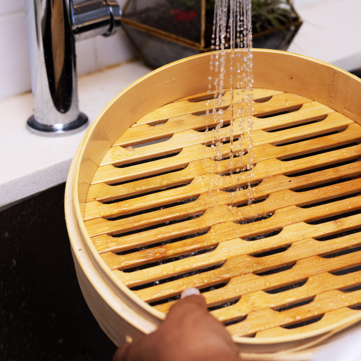 Joyce Chen bamboo steamer placed in a wok for efficient cooking
