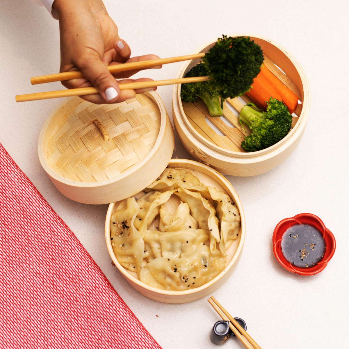 Joyce Chen bamboo steamer with vegetables steaming to preserve color and moisture.