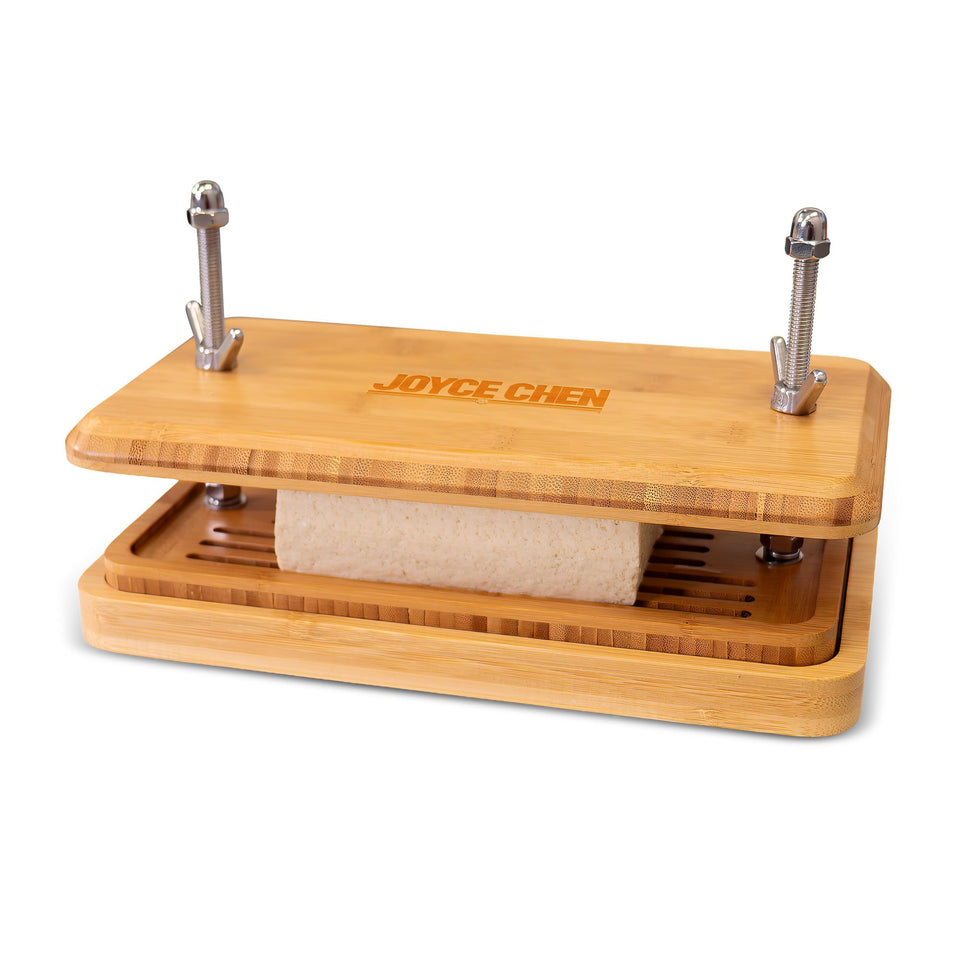 Joyce Chen Bamboo Tofu Press with built-in drainage grate for mess-free water removal.