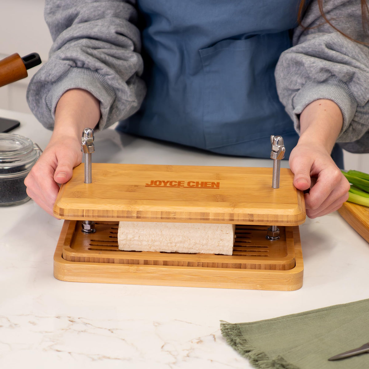 Joyce Chen Bamboo Tofu Press with removable drip tray for easy cleanup.