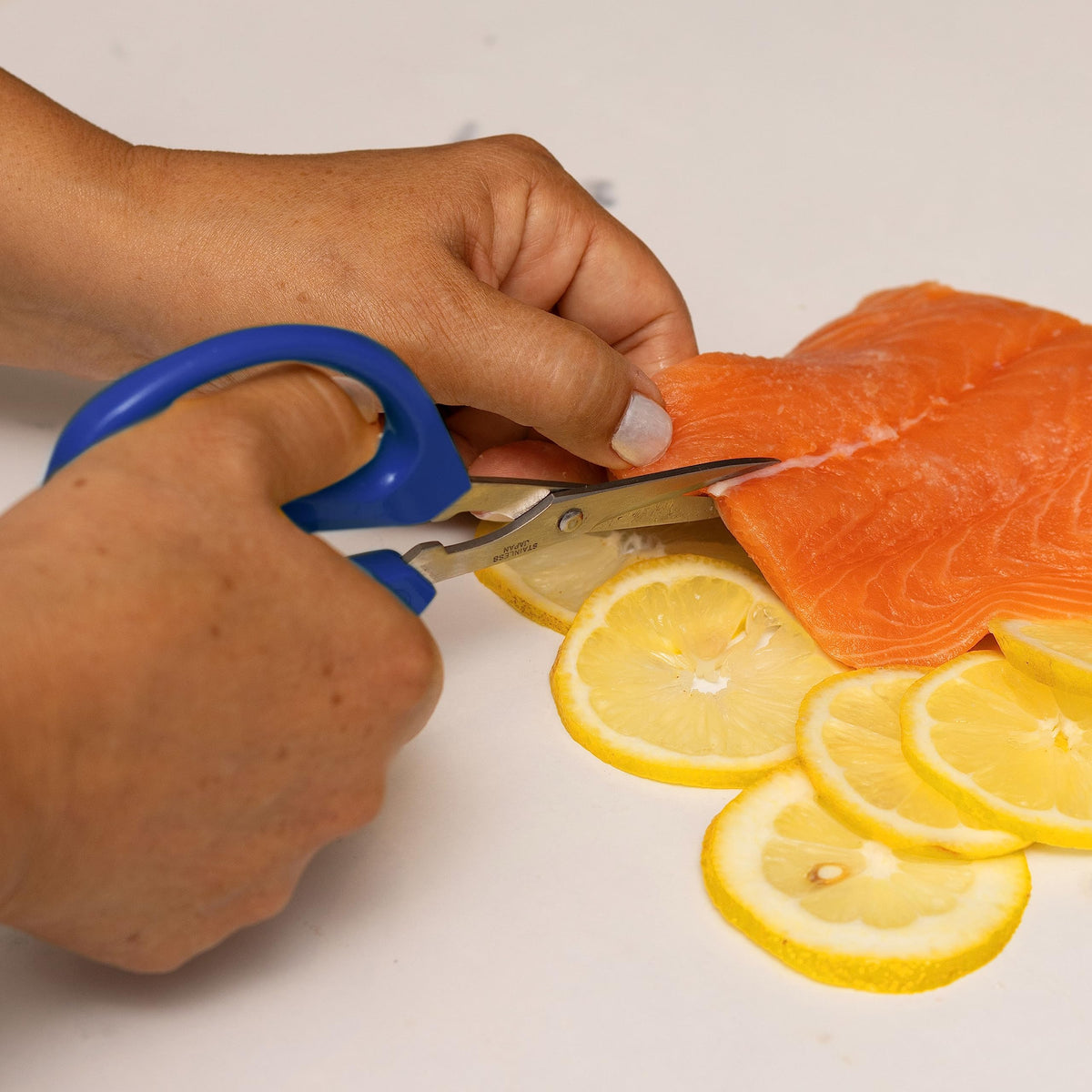 Joyce Chen Original Unlimited Scissors slicing meat and cheese effortlessly