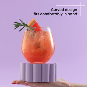 Close-up of JoyJolt Spirits stemless design fitting comfortably in hand