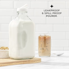 JoyJolt textured-grip glass bottle, comfortable to hold during mixing or pouring.