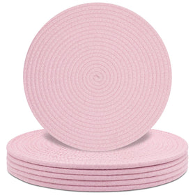 Jukercici round pink placemats with woven texture protect surfaces during meals.