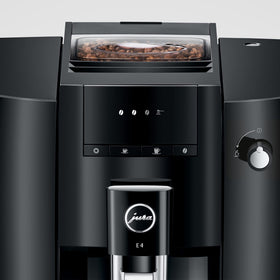 Jura E4 bean container highlighting fresh grounds for rich flavor.