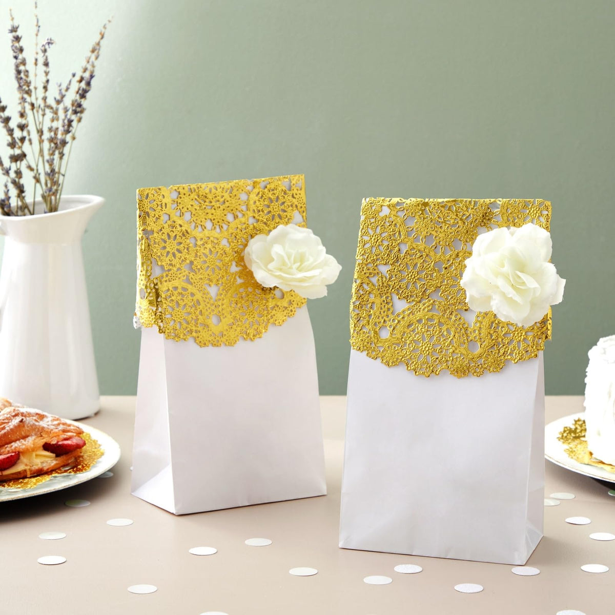 Juvale gold doilies enhancing a cake display at an event.