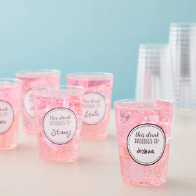Juvale peel-and-stick sticker being applied to a plastic cup for easy labeling