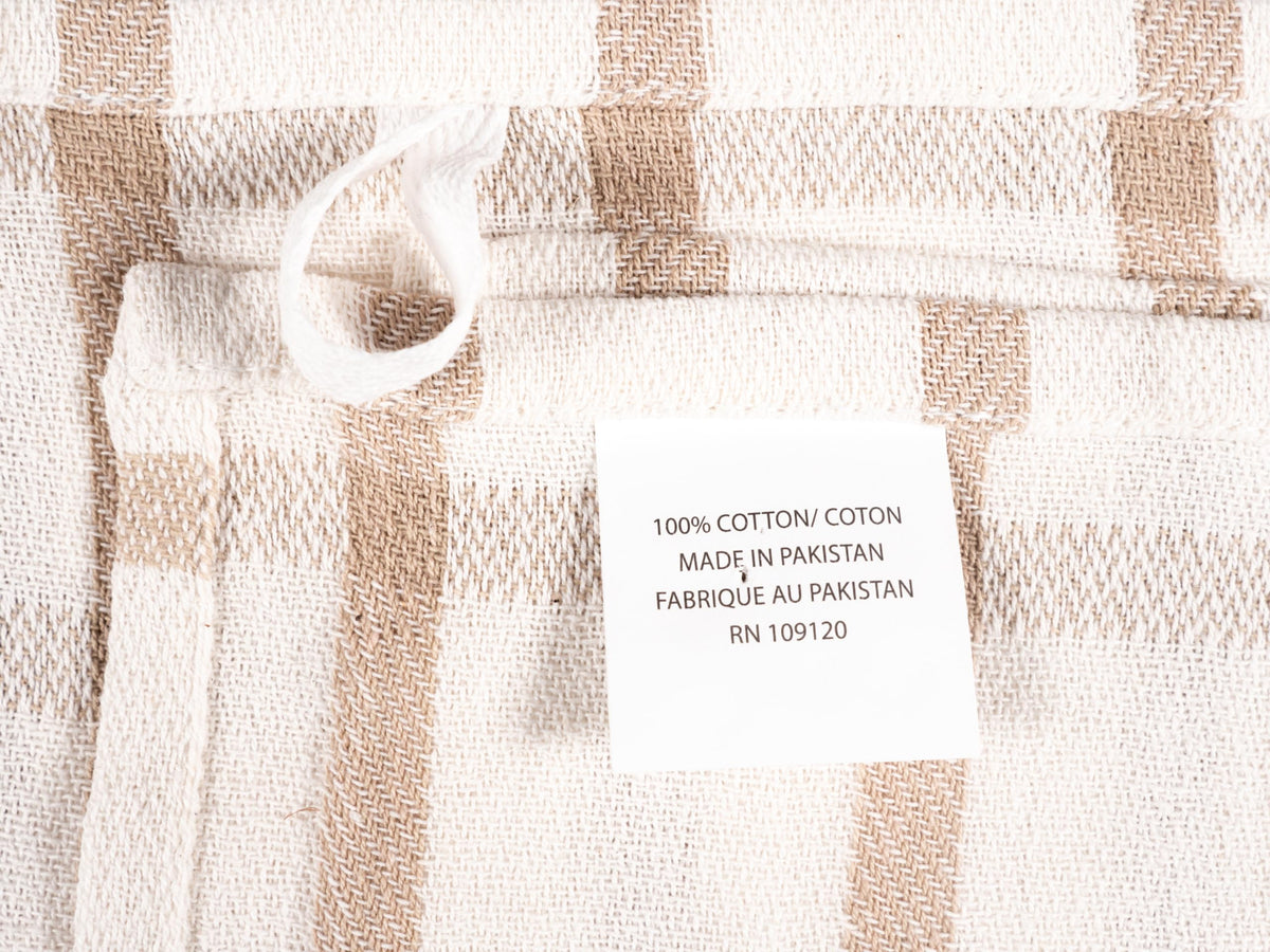 KAF Home beige flat kitchen towels stored in a drawer.