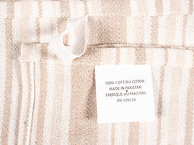KAF Home beige flat kitchen towels on a towel rack.