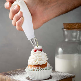 Kalione white hangable pastry bags save space in your setup.