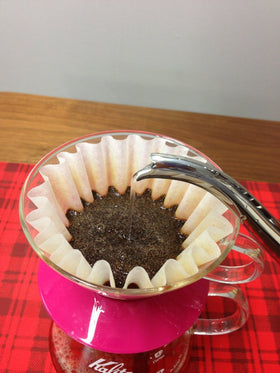 Kalita Wave filters 185 white close-up emphasizing premium Japanese filtration.