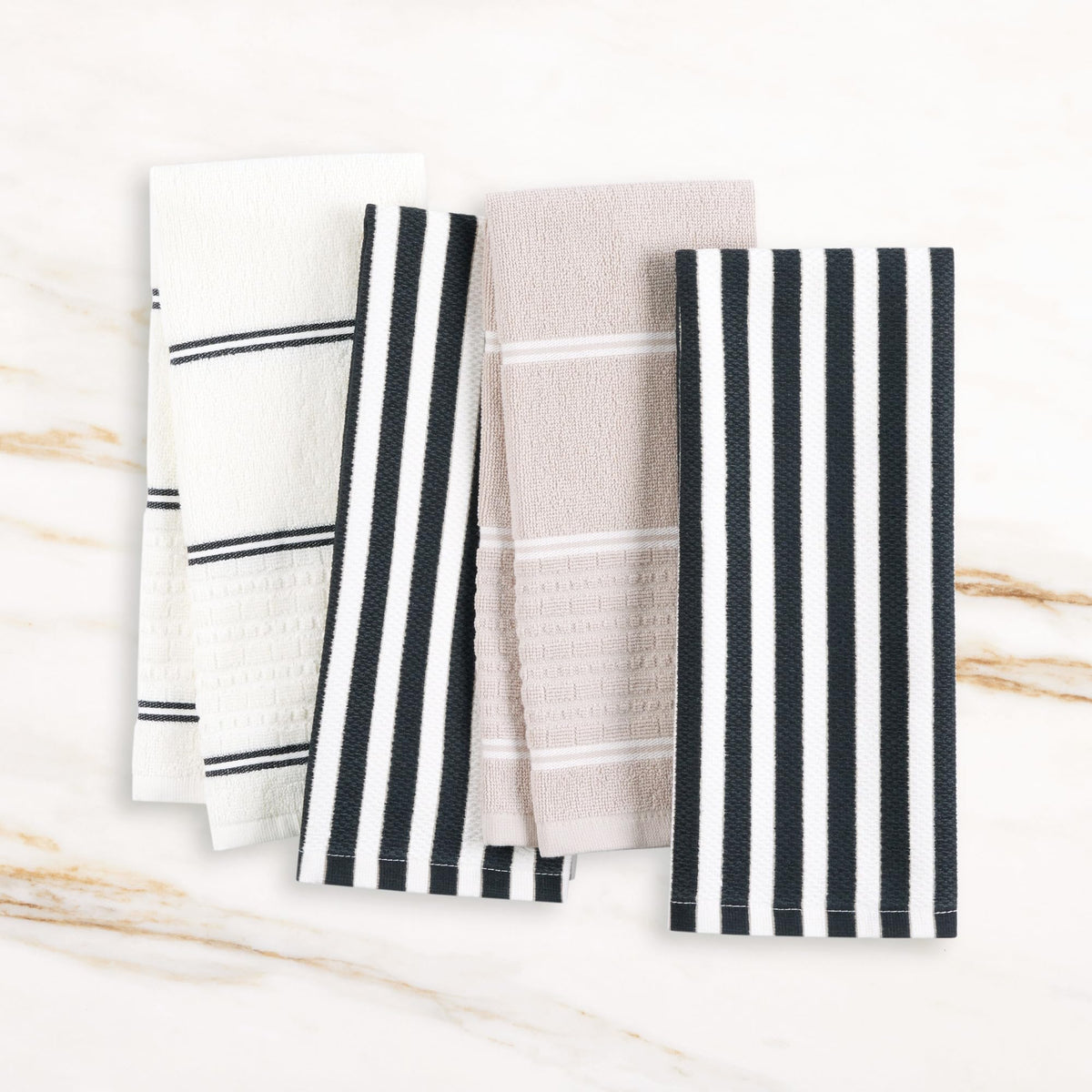 kate spade new york towel set shown on rack for drying and decor