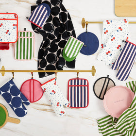kate spade new york two-pack oven mitts with loop for easy hanging storage.