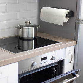 Katzco magnetic paper towel holder on workbench with rubber coating protects surfaces