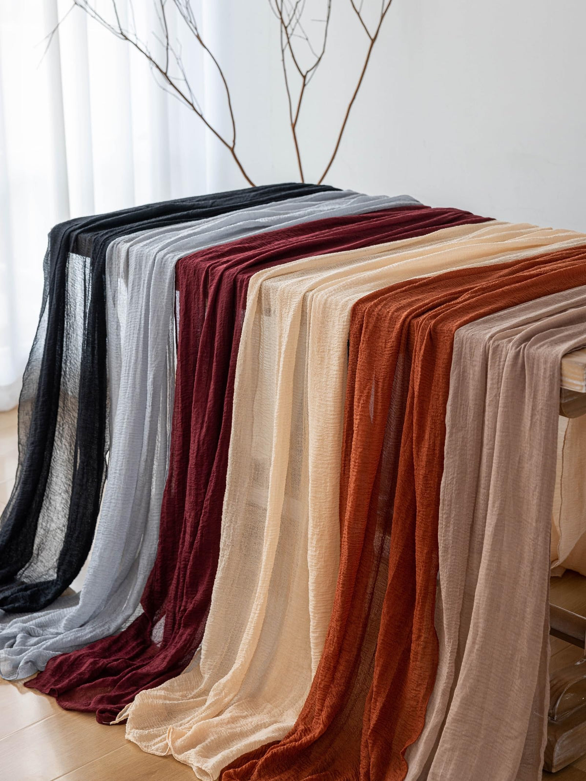 Keketoarrange black gauze runner creates soft drape for baby showers.
