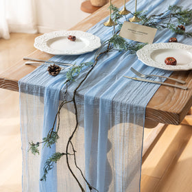 Keketoarrange light blue gauze table runner closeup shows soft drape for elegant tables.