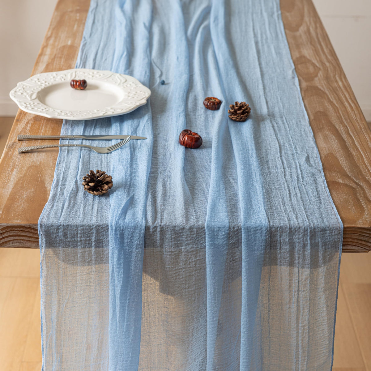 Keketoarrange rustic cheesecloth wedding runner setup adds boho charm to reception.