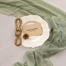 Keketoarrange table runner adds boho charm to bridal shower centerpieces.