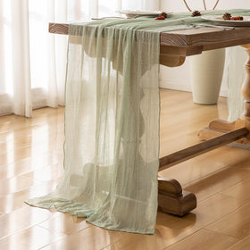 Keketoarrange sage green table runner for baby shower table settings.