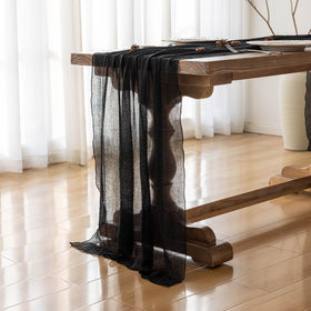 Keketoarrange table runner on wood tabletop demonstrates versatile decor for events.
