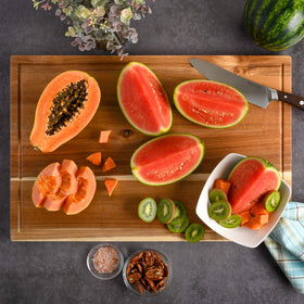 Kenmore Kenosha acacia cutting board in use shows knife-friendly surface and easy chopping action