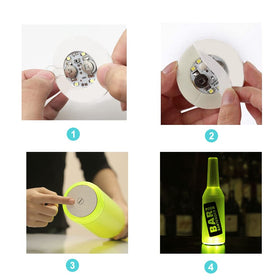 Kensally bottle lights illuminate champagne bottles with vibrant white light.