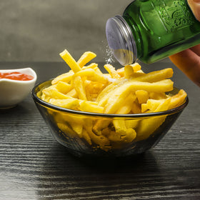 Solid feel of Kerixi green glass shakers; sturdy heft for everyday use.