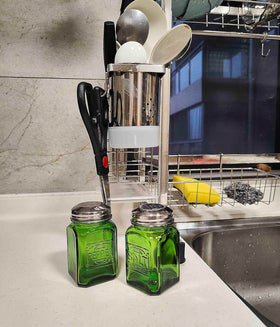 Kerixi easy-to-hold shakers in green glass for table-side seasoning.