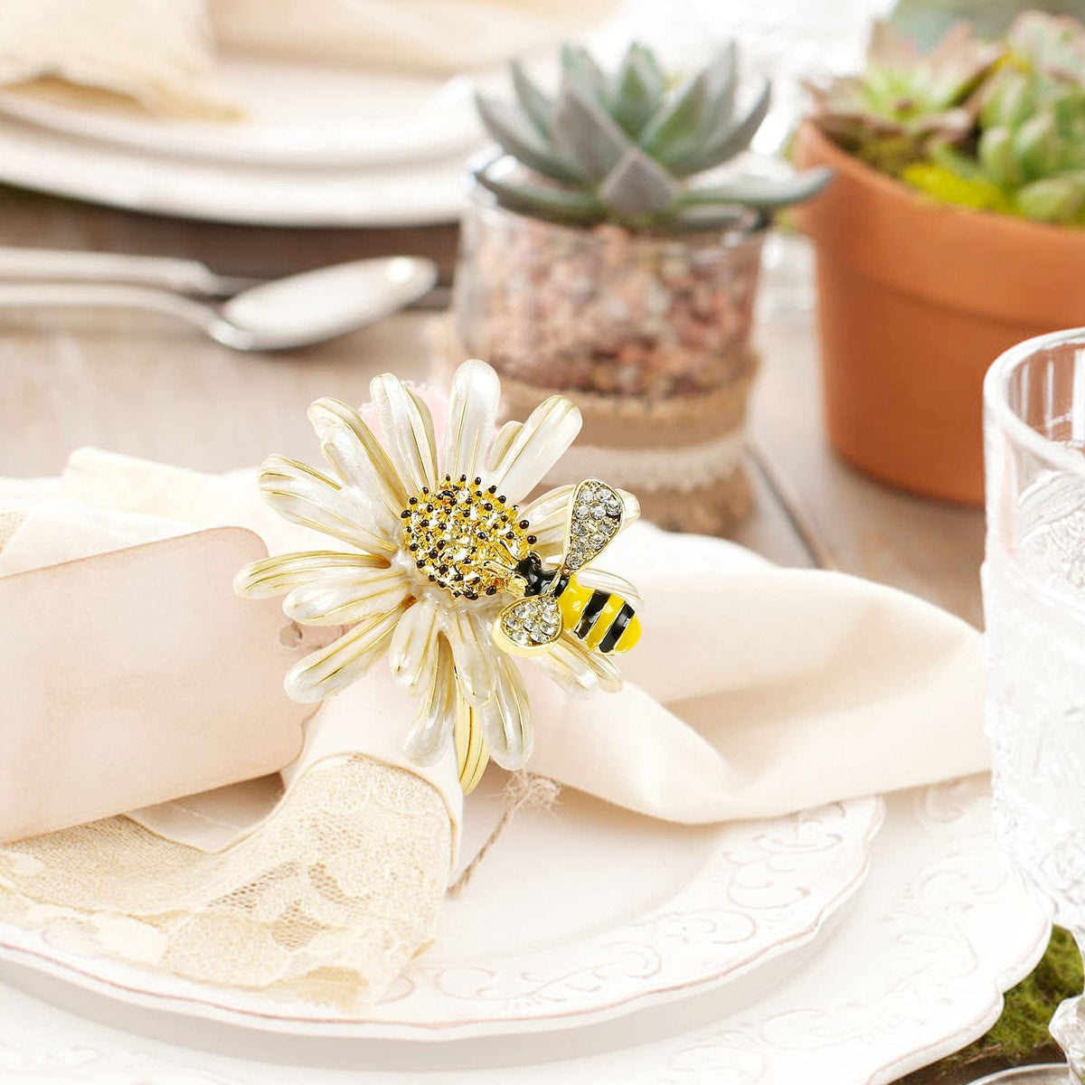 Kesote napkin ring close-up shows bee and flower detail for elegance
