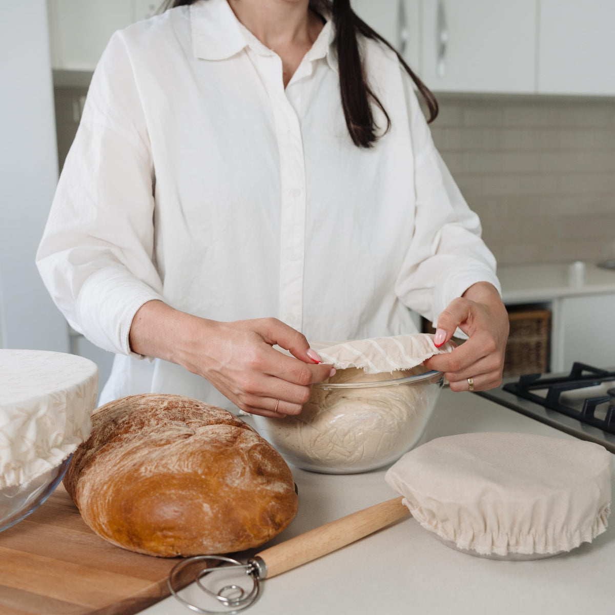 KIBAGA beige-patterned bowl cover adds a stylish kitchen touch.